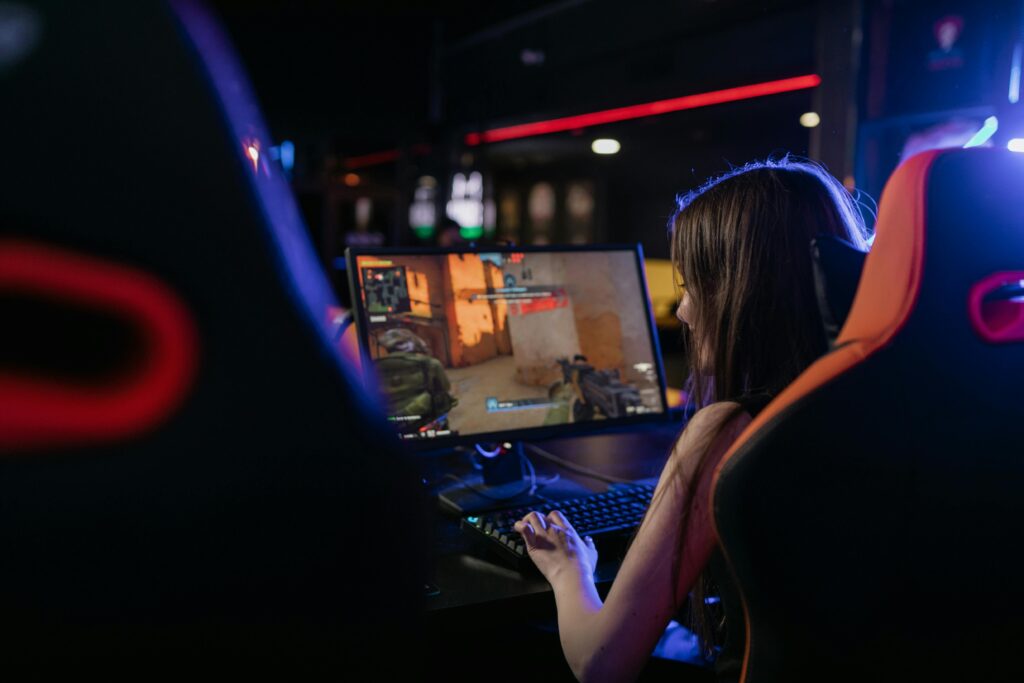  world of warcraft Media library screen showing thumbnails including a woman gaming and an RGB desktop computer.